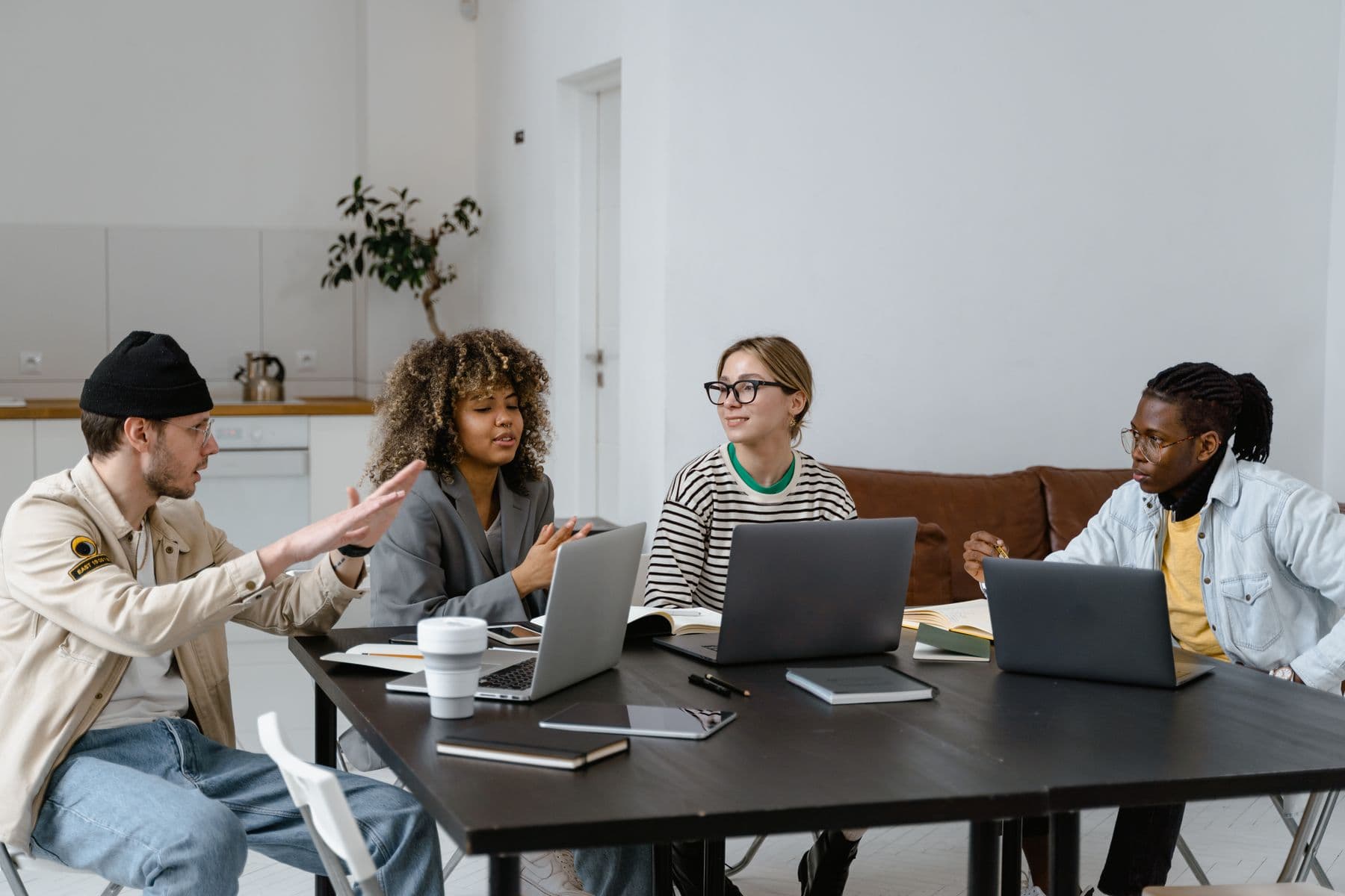 A team discussing a project around a table