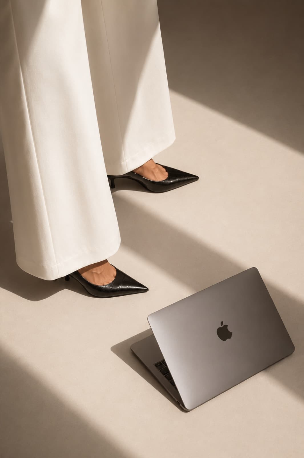 A planner working on a laptop